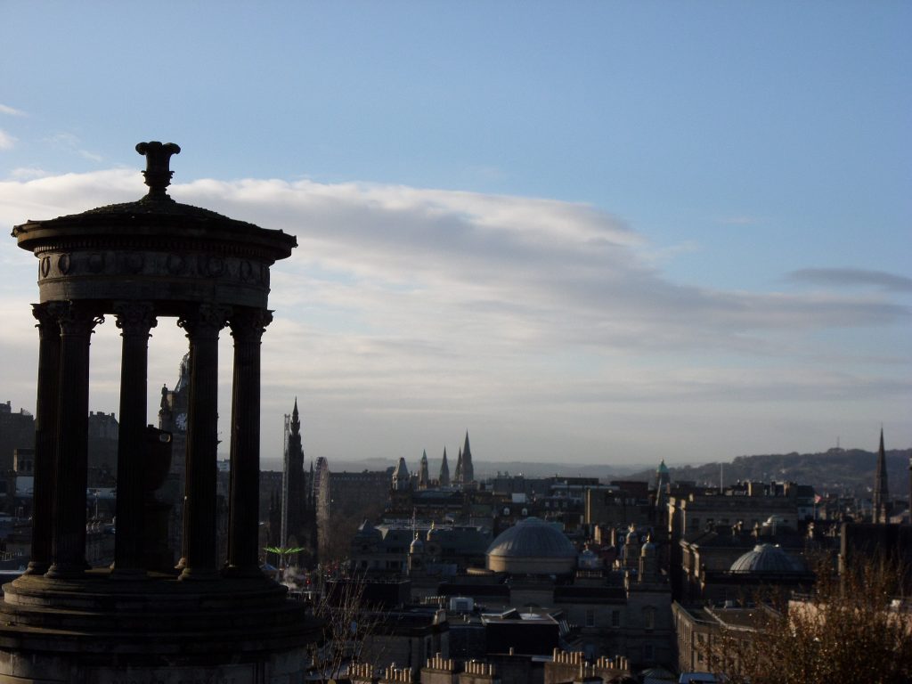 Dugald Stewart Monument and Edinburgh city center (photo by Lely Tri W)
